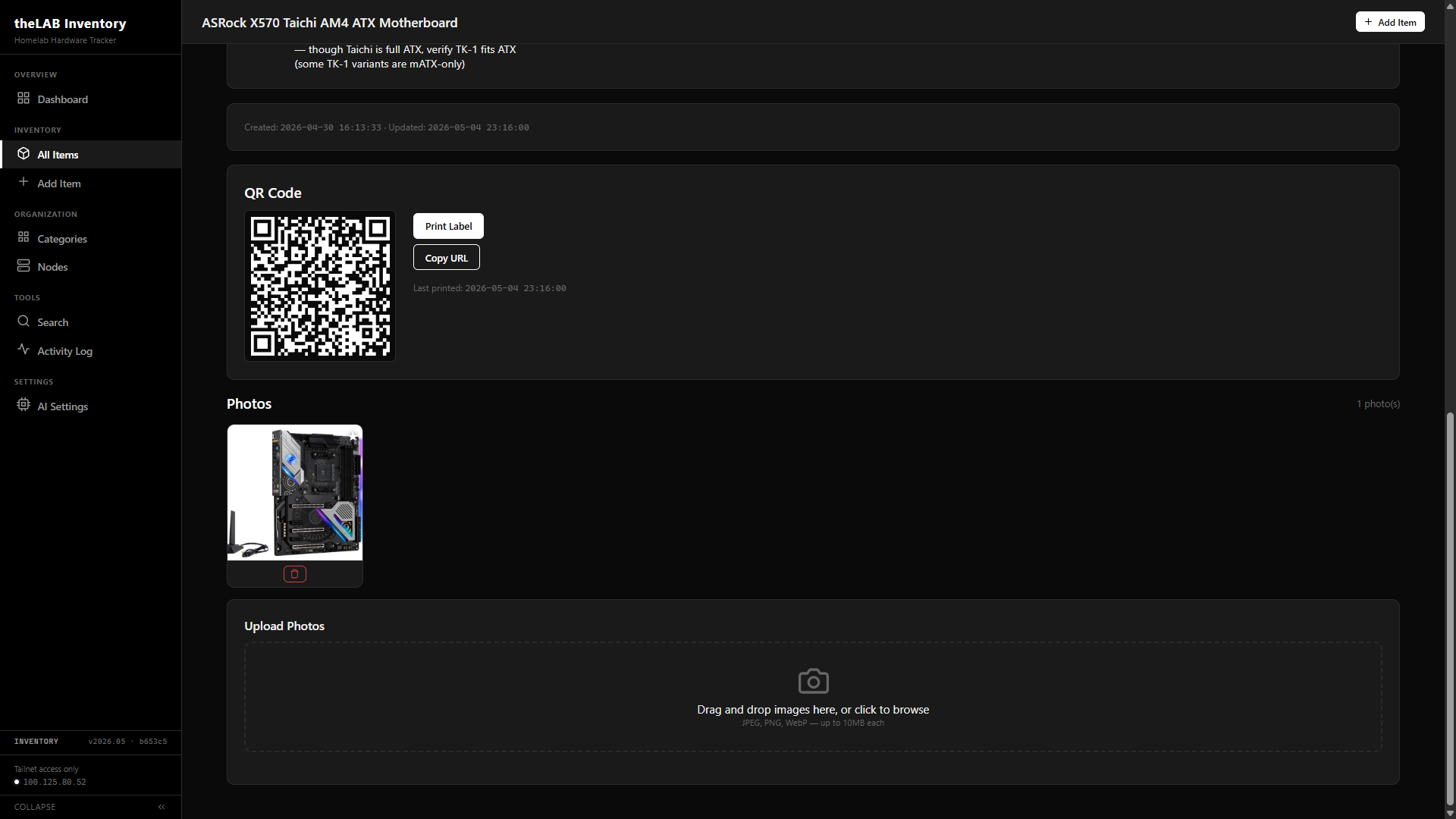 theLAB Inventory item detail view showing the ASRock X570 Taichi entry — notes, created and updated timestamps, generated QR code with Print Label and Copy URL buttons, and a photo gallery with one motherboard photo and a drag-and-drop upload area